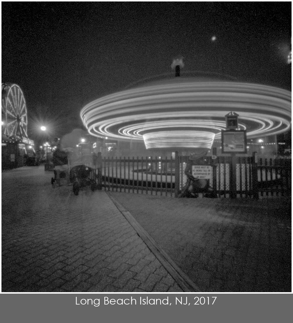 Pinhole photo by Nancy Breslin of a spinning carouselat night at Fantasy Island on Long Beach Island, NJ.